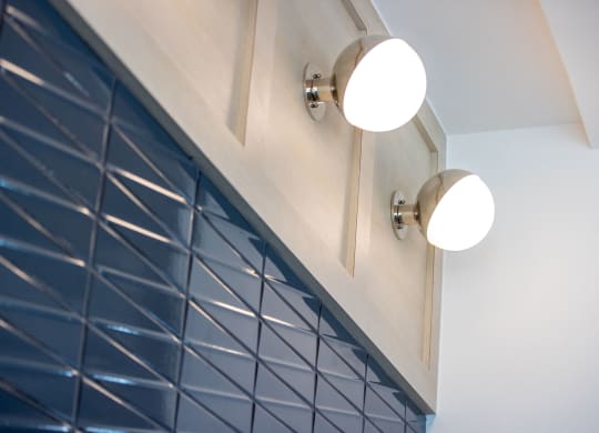 a close up of a cabinet with two lights on it