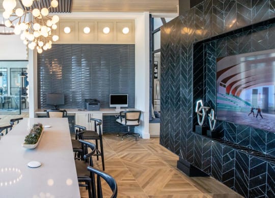 a conference room with a large tv and a table with chairs