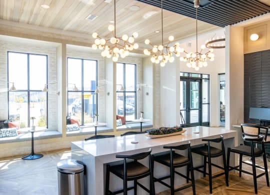 a large dining room with a large table and chairs