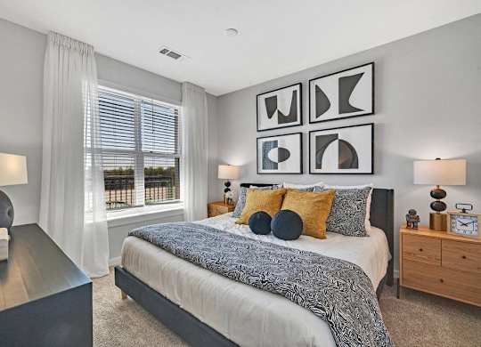a bedroom with a bed and a window