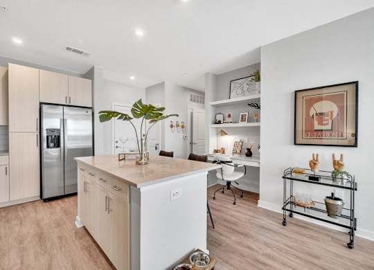 a kitchen with a large island in the middle