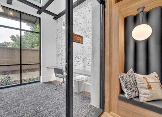 a bathroom with a shower and a toilet and a window