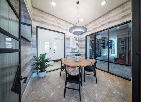 a dining room with a table and chairs