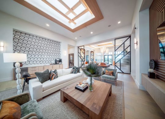a living room with a white couch and a coffee table