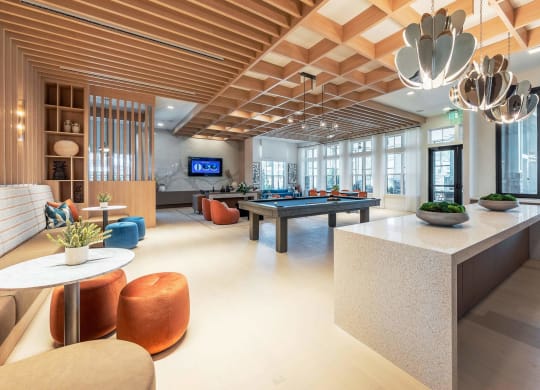 the lobby of a hotel with a pool table
