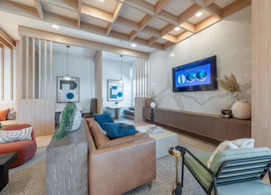 a living room with a couch and a wall filled with geometric patterns