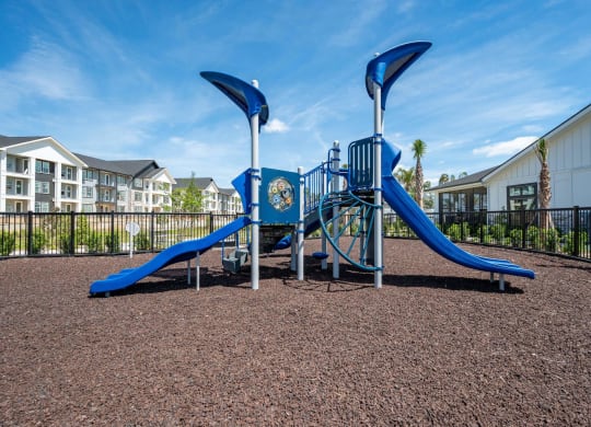 our playground is equipped with a swing set and slides