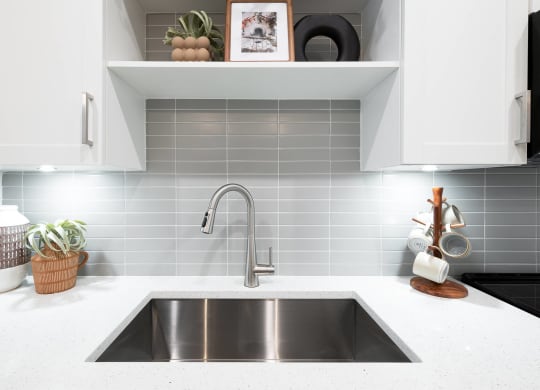 a kitchen with a sink and a faucet