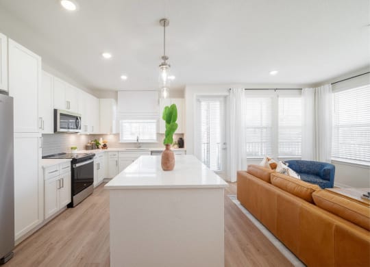 a kitchen with white cabinets and a white counter top