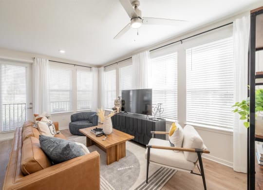 a living room with a couch and a tv