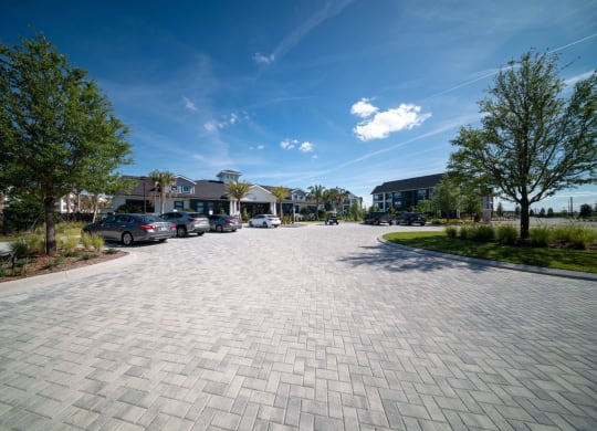 a parking lot with cars parked on the side of a street