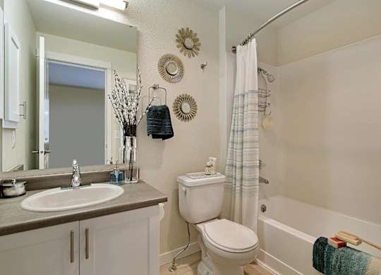 Full bathroom with tub shower combo and vanity at Hidden River Townhomes Apartments, Kirkland, WA 98034