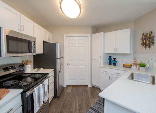 Kitchen with white counter and sink at The Arden, Gresham, 97080