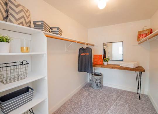 Large Walk-in closet with shelves and mirror at The Arden, Oregon, 97080