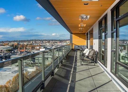 A balcony with a view of a cityscape.at Axle, Seattle 