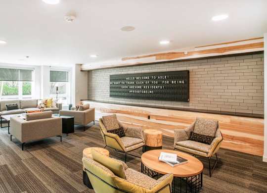 A waiting room with a sign that says at Axle, Seattle, 98119 