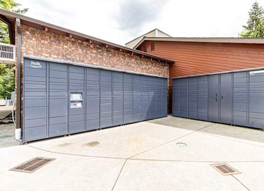 A building with a brick wall and a garage door.