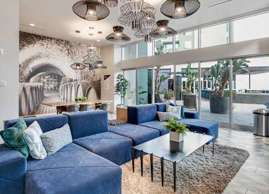 A living room with a blue couch and a coffee table.