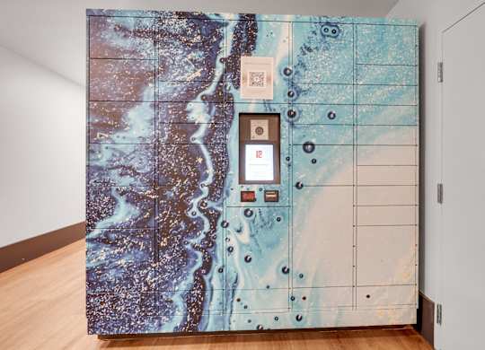 A large safe with a blue and brown marbled pattern is installed in a room.