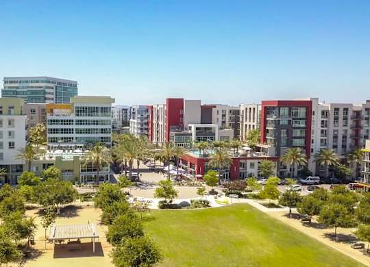 A cityscape with a mix of residential and commercial buildings.