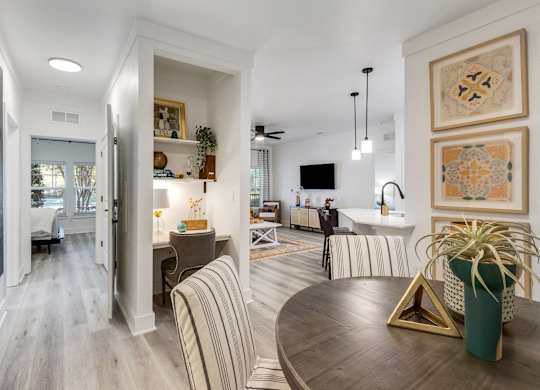 A modern living room with a striped sofa and a coffee table.