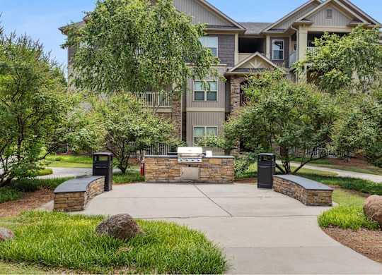 A large house with a driveway and a gate.