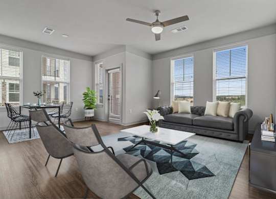 A modern living room with a grey sofa, a coffee table, and a television.