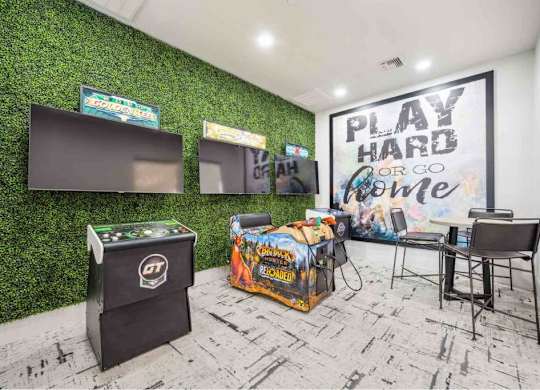 A room with a green wall and a sign that says