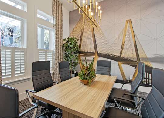 a conference room with a wooden table and chairs