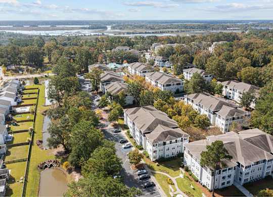 an aerial view of a city with houses and trees