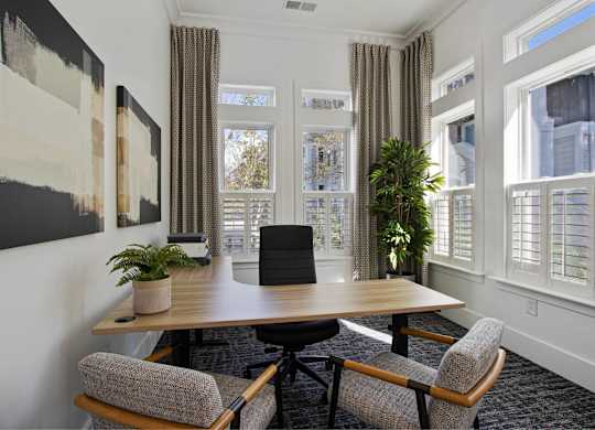 a conference room with a wooden table and chairs and windows