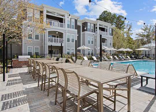 our apartments offer a swimming pool and a patio with chairs