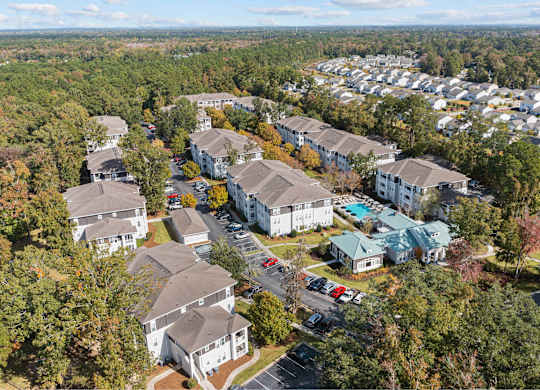 an aerial view of a neighborhood with houses and trees