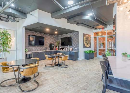 A modern dining area with a glass table and chairs.