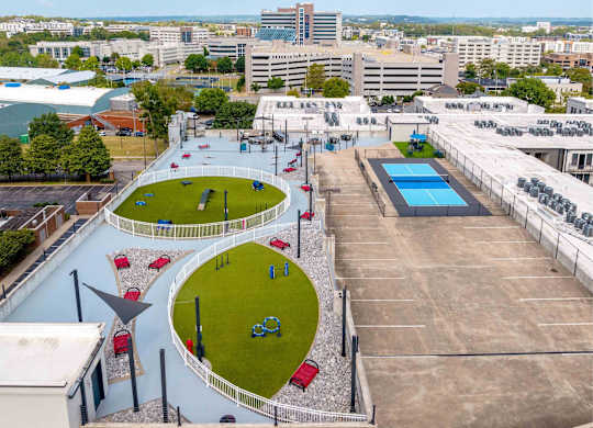 A playground with a blue pool and a slide.