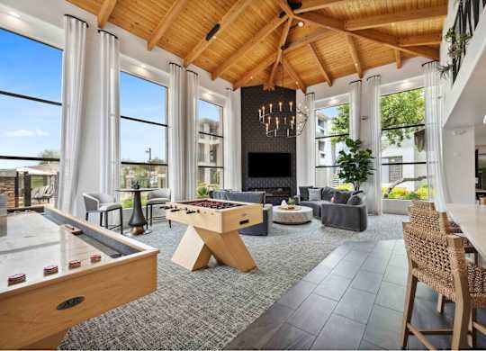 Clubhouse with a pool table and a foosball table