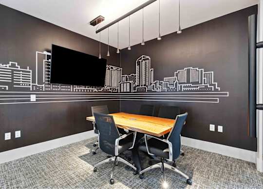 our office has a large conference room with a table and chairs