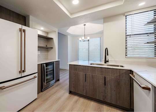 a kitchen with a sink and a refrigerator