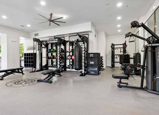 A spacious home gym with a variety of equipment.