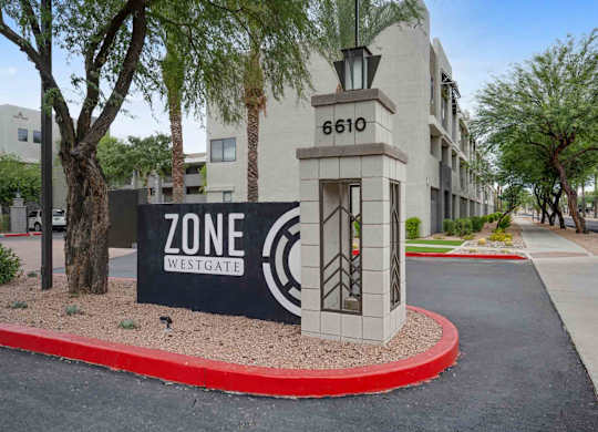 A sign for Zone Westgate is in front of a building with the number 6610.