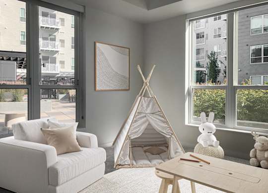 a living room with a teepee and a couch and a coffee table