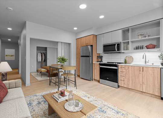 A modern kitchen with wooden cabinets and stainless steel appliances.