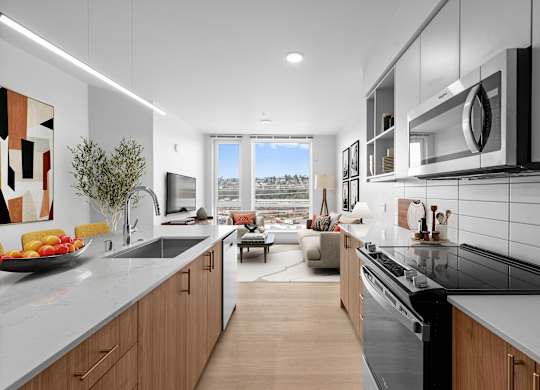A modern kitchen with a view of the city.