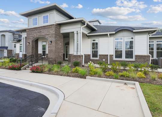A house with a driveway in front of it.