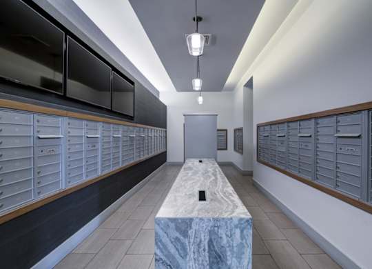 A long hallway with a marble bench in the middle.
