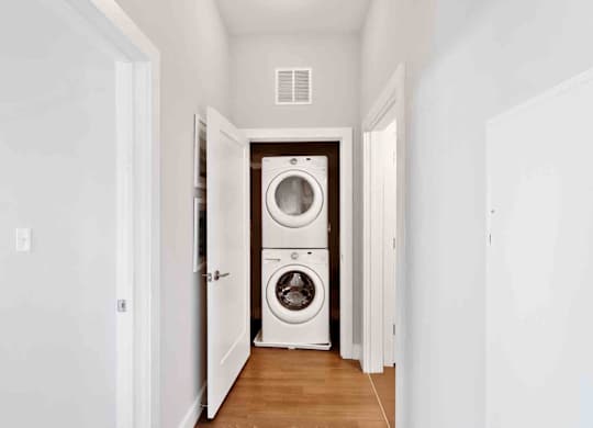 A laundry room with a washer and dryer in it.