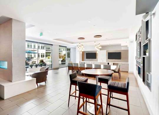 A modern dining area with a table set for four.