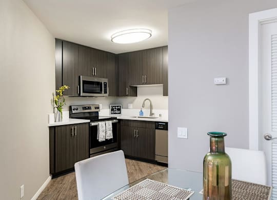 Kitchen with Dining Area at Village Square, La Jolla California
