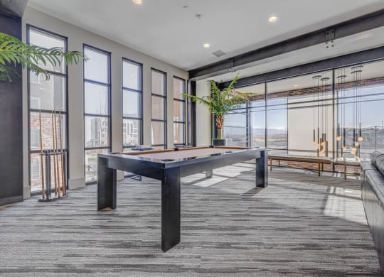 a games room with a pool table