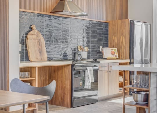 a kitchen with a stove and a refrigerator